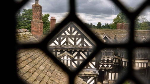 View through a lead window into the courtyard at Little Moreton Hall, Cheshire